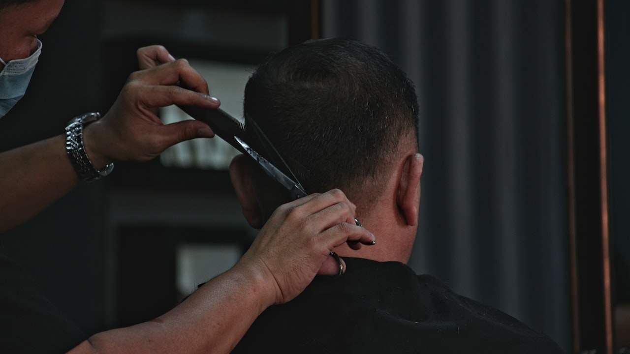 Do you need to buy a pair of scissors to study in a barbershop?